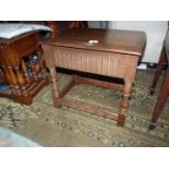 An Old Charm/Priory Oak type Occasional Table having a fluted fronted drawer to the front,