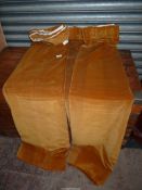 A pair of cotton velvet Curtains in a tan colour, lined, 108'' wide x 57'' drop.
