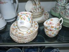 An pretty part Teaset marked '2554' to base including six cups and nine saucers plus nine larger