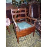 A Mahogany framed Ladderback Commode Chair standing on turned front legs, furnished.