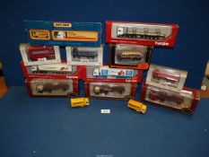 A quantity of boxed model vehicles including Bedford Bus, Matchbox Express truck, etc.