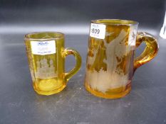 Two Amber glass Tankards, the smaller marked Weisbaden, (the larger one a/f).