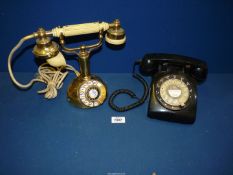 Two vintage telephones; one black, the other being a regency 1960's telephone.