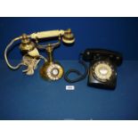 Two vintage telephones; one black, the other being a regency 1960's telephone.