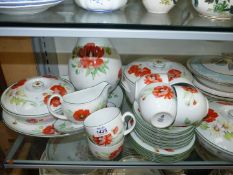 A large quantity of Royal Worcester 'Poppy' pattern to include cups and saucers and side plates,