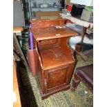 A Walnut and Mahogany floor standing Cupboard having a raised and fieled panel,