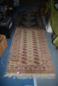 A dark blue and grey rug, a/f ,60'' x 40'' together with a tan ground bordered,