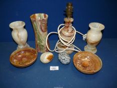 A quantity of stone/onyx to include; table lamp, vases, dishes, etc.