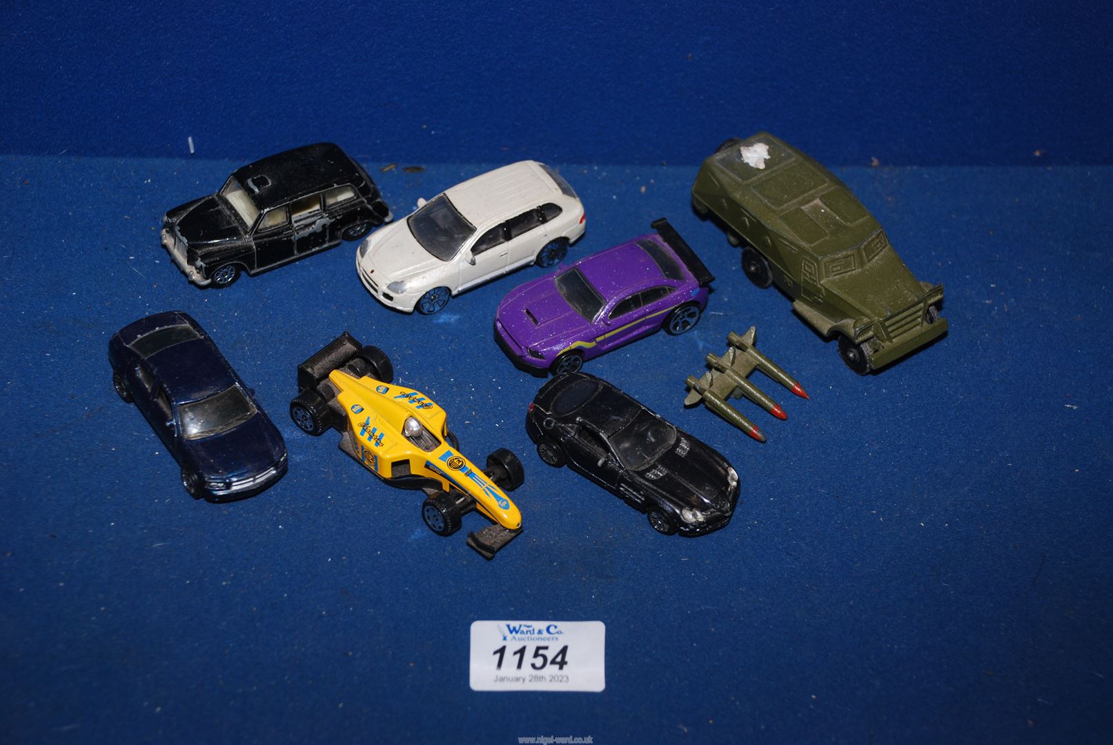 A small quantity of toy cars including Corgi London taxi, army jeep, Fastlane purple car, etc.