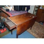 A good quality Mahogany/Wardrobe Pembroke Table standing on tapering square legs and having a