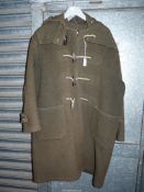 A Gloverall Pure Wool green duffle Coat with hood, horn toggles, some wear, size approx. large.