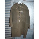 A Gloverall Pure Wool green duffle Coat with hood, horn toggles, some wear, size approx. large.