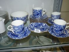 A quantity of Royal Crown Derby Peacock blue tea ware having gilt rim consisting of four cups,