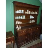 An Oak North Wales type Welsh Dresser, the base with three frieze drawers,