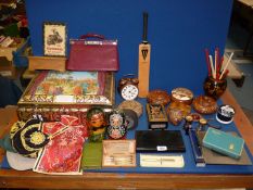 A quantity of miscellanea including Russian dolls, leather handbag, stone ornament,