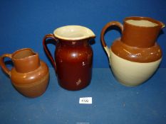 A treacle glazed jug, plus another salt glazed jug, (both a/f) and a heavy salt glazed jug.
