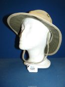 A hat - The Tilley Hat, size 7 1/8", made in Canada.