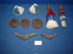 A quantity of horse harness decoration including nose brasses,