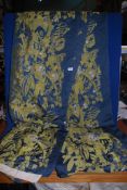 A pair of blue and gold patterned curtains, fully lined,