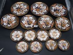 A quantity of Royal Crown Derby Imari pattern plates and saucers including twelve tea plates,