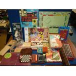 A quantity of board and card games including Monopoly, Mastermind, Scrabble, chess pieces etc.
