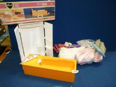 A Sindy bed, wardrobe and bath (in original box), and some Sindy clothes.