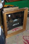 A gilt framed wall Mirror, some chips to the frame, 25'' x 27''.