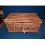 A wicker picnic Hamper.