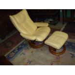 An Ekornes Stressless cream hide upholstered reclining chair and matching footstool,