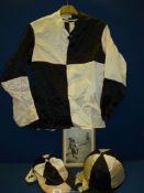 A set of black and white jockey silks and riding hat in quadrants with provenance by way of
