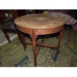 A crossbanded and inlaid Circular Topped Occasional Table standing on tapering square legs with