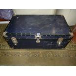 A black hardboard Trunk, with metal fasteners, 20" x 14" x 36" long.