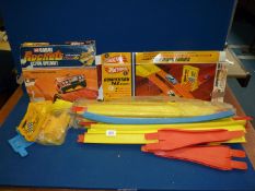 A Hot wheels 'competition' pack by Matley plus a Corgi 'Rocket' Action Speedset track (no cars