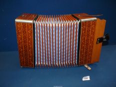 A Hohner Accordian, made in Germany, good condition.