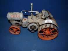 A Titan model tractor made of tin, 12 1/2" long x 8 1/2" tall.