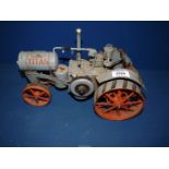 A Titan model tractor made of tin, 12 1/2" long x 8 1/2" tall.