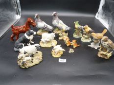 Miscellaneous china animals to include; birds, a pair of stock Doves, cats,