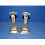 A pair of elegant silver plated Corinthian column Candlesticks by T.B & S., 7" tall.