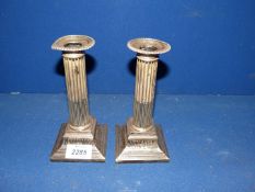 A pair of elegant silver plated Corinthian column Candlesticks by T.B & S., 7" tall.