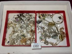 A quantity of white metal necklaces, some Dolphin pendants, matching earrings, glass pendants etc.