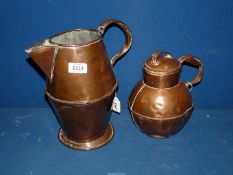 Two copper jugs.