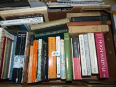 A box of books including 'Wilfred the Singer', 'The Danakil Diary',