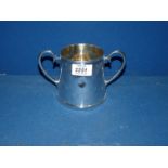 A two handled silver plated Tankard (small dent).