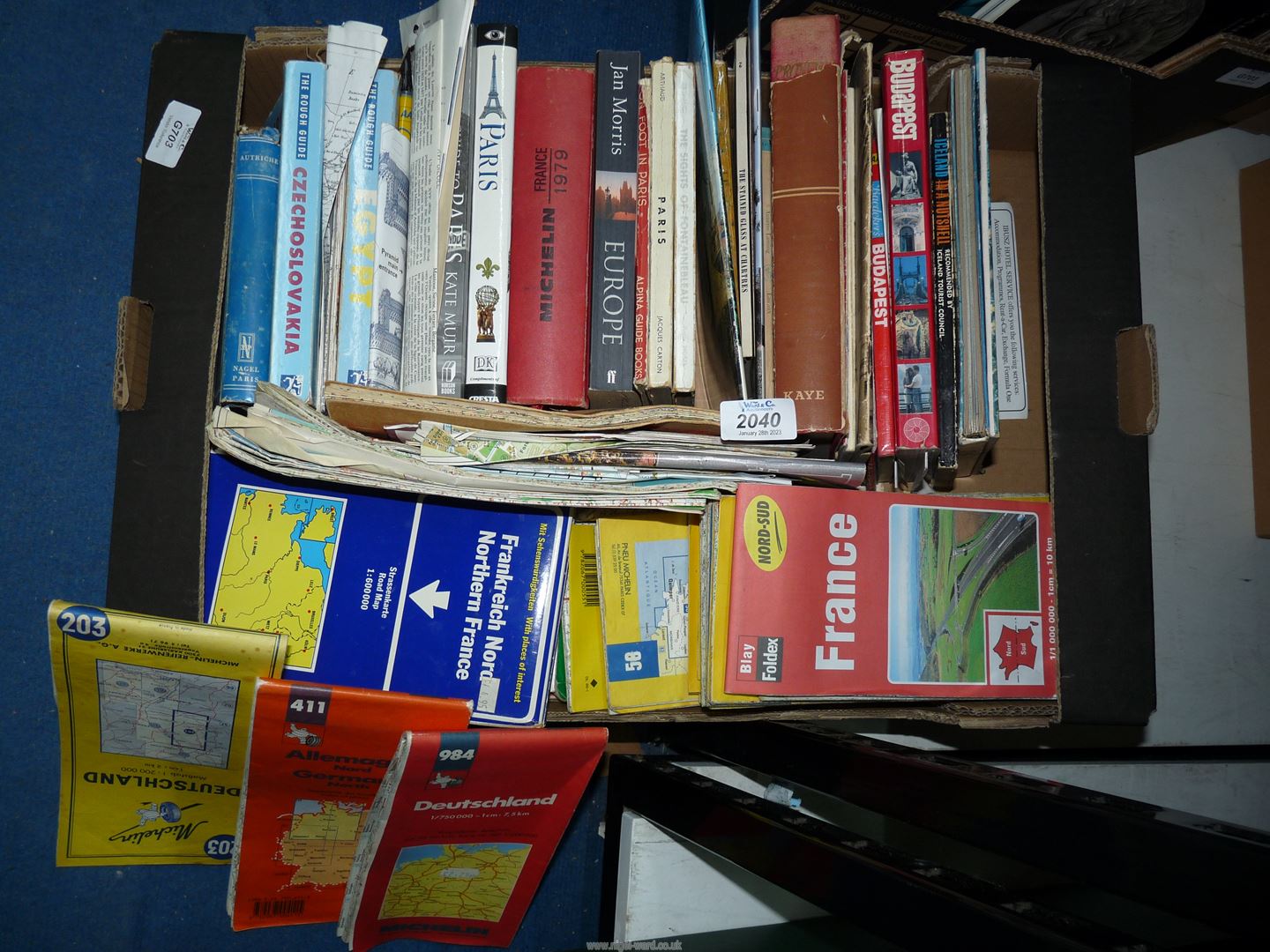 A quantity of tourist books and foreign maps including Paris, Europe, Budapest etc.