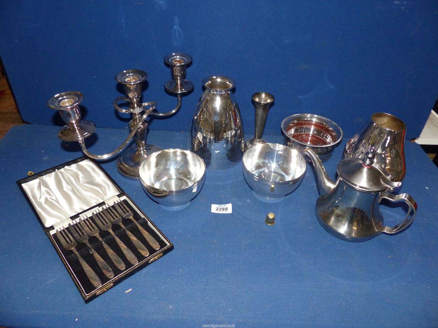 A small quantity of silver plate including candelabra, cased set of pastry forks, coaster, bud vase,