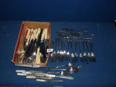 A quantity of plated cutlery including forks, bone handled knives, spoons, etc.
