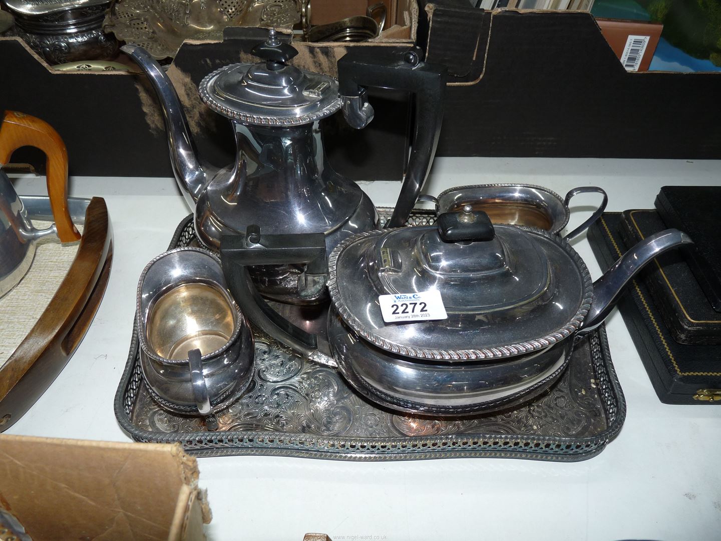 A four piece EPNS tea set and tray to include; teapot, hot water pot, milk jug and sugar bowl.