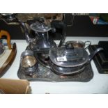 A four piece EPNS tea set and tray to include; teapot, hot water pot, milk jug and sugar bowl.