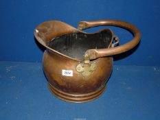 A copper helmet coal bucket.