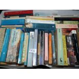 A box of paperback novels including 'Pushkin', 'Grey Wolf',